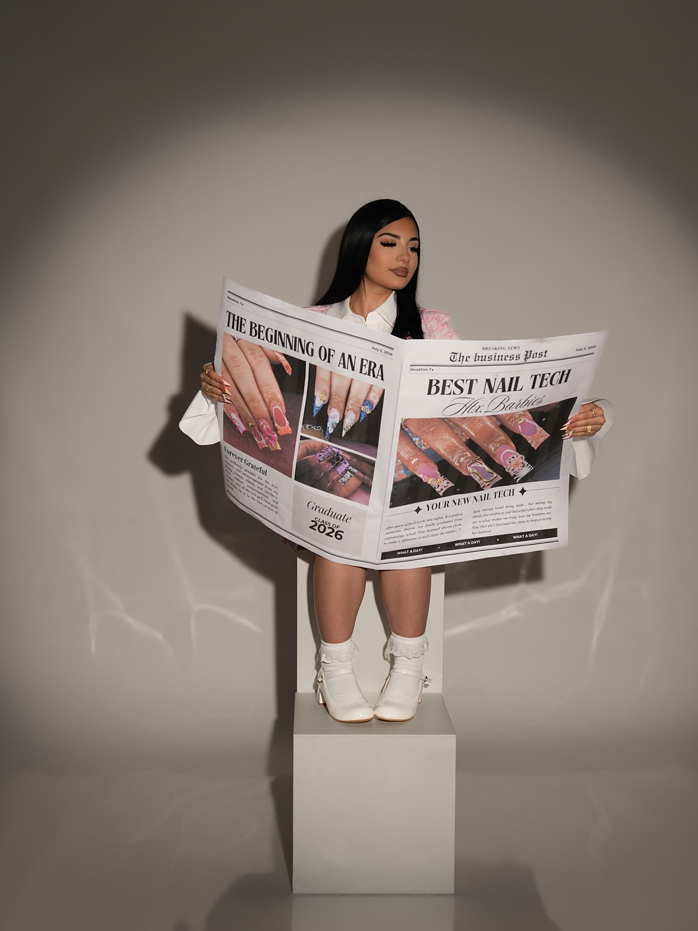 Sharon holding the HTX.BARBIES paper
